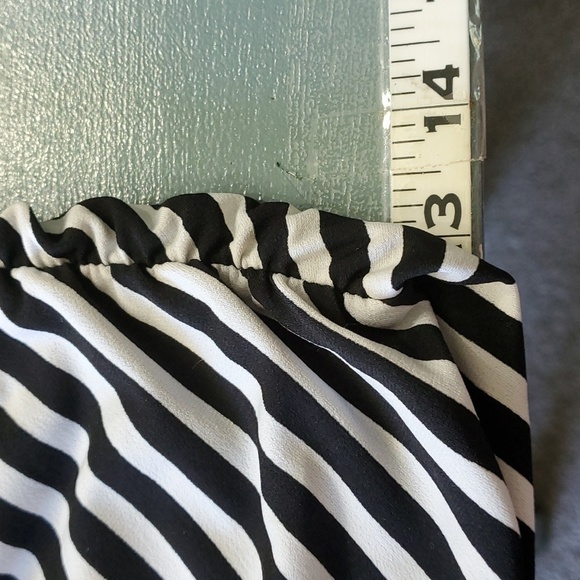 Haulter jumpsuits. Black and white striped top. Black bottom Wide leg. By Lepis - Picture 8 of 8